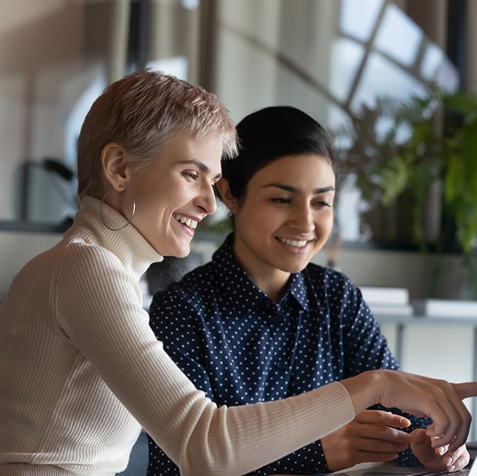 co-workers-working-on-computer-together