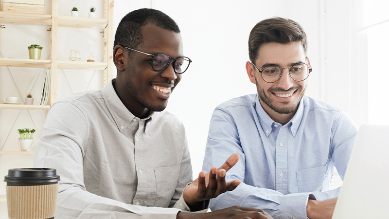 coworkers-reviewing-computer-together