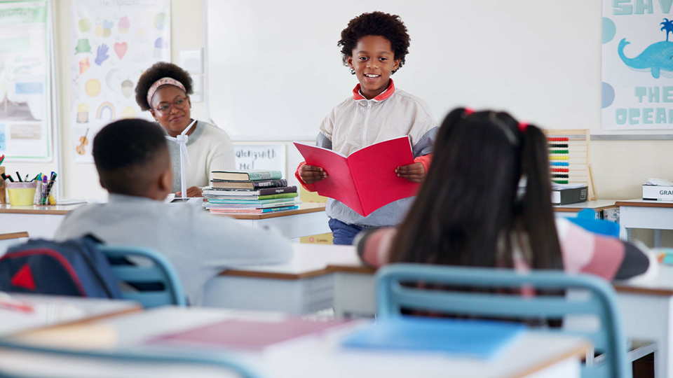 young-student-presenting-to-classroom