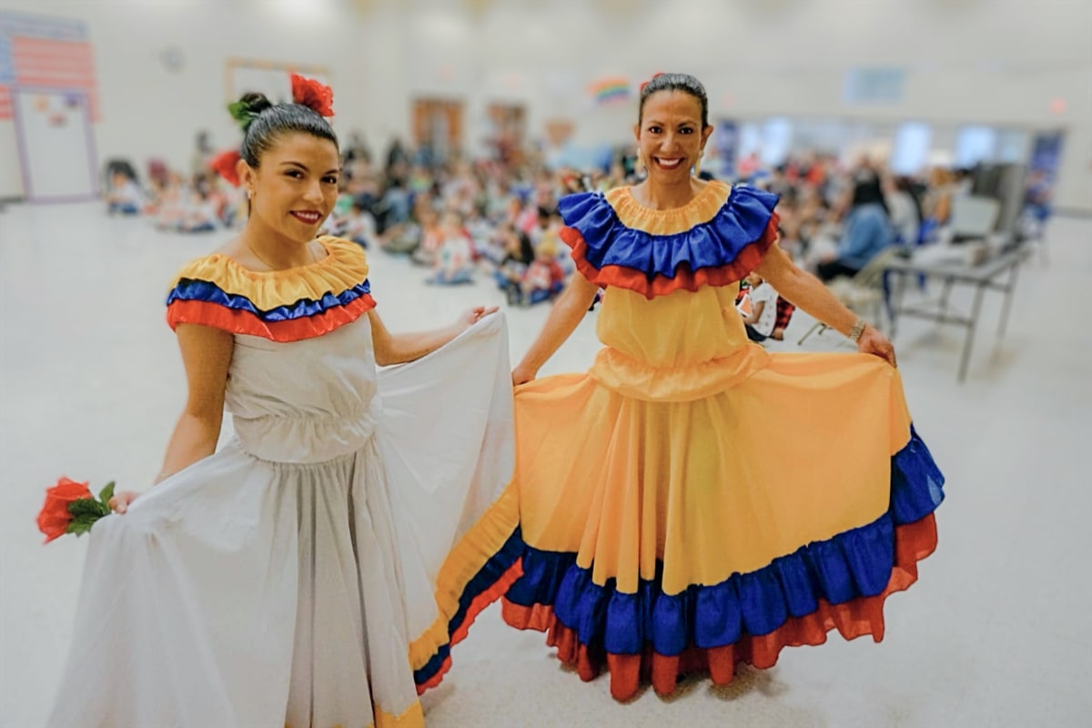 Diana and Sandra wearing traditional Honduran dress for students